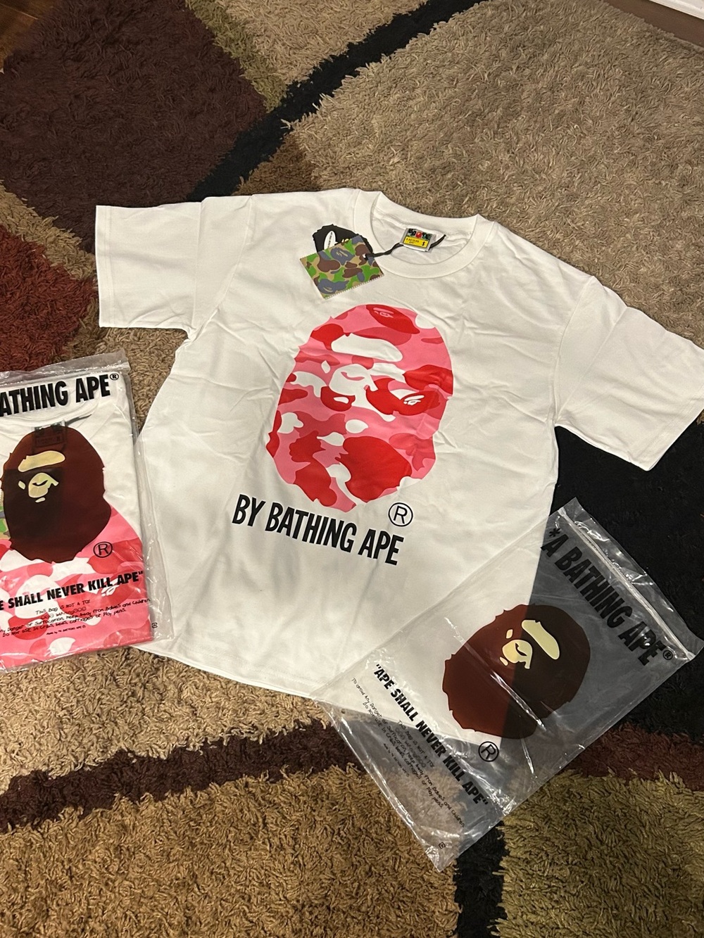 By BATHING APE White Tee with Pink Camo Ape Logo size S and M